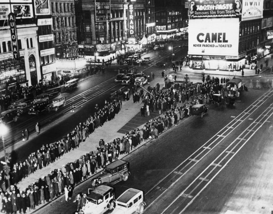 Unemployed people wait in line for rations in Times Square during the Great Depression