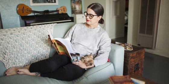 Woman on couch reading