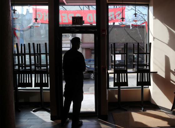 Owner and chef Anthony Caldwell looks out from 50Kitchen in the Field's Corner neighborhood of Boston on March 18, 2020.