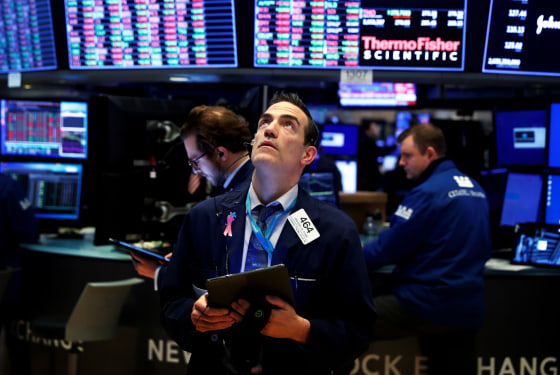 Image: Traders work the floor of the New York Stock Exchange on March 20, 2020.