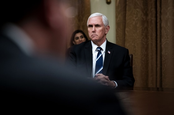 Image: Vice President Mike Pence listens during a meeting in the Cabinet Room of the White House on April 27, 2020.