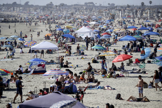 Image: People visit Newport Beach in California on May 24, 2020.