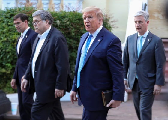 Image: President Donald Trump walks with Defense Secretary Mark Esper, Attorney General Bill Barr and National Security Advisor Robert O'Brien