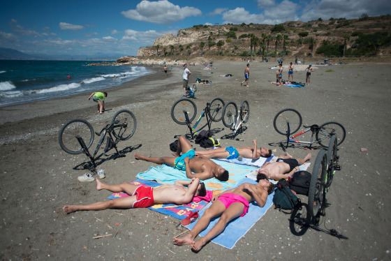 Image: People sunbathe at La Arana Beach in Malaga on June 7, 2020, as lockdown measures are eased during the novel coronavirus COVID-19 pandemic.