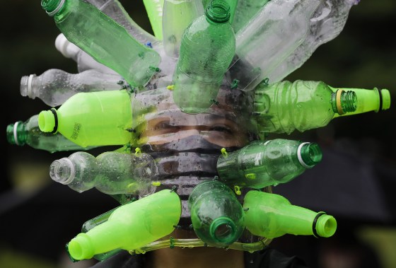 Image: A protester wears a face shield made of recycled plastic bottles by artist Leeroy New during a anti-terror bill rally at the University of the Philippines as they observe Independence Day