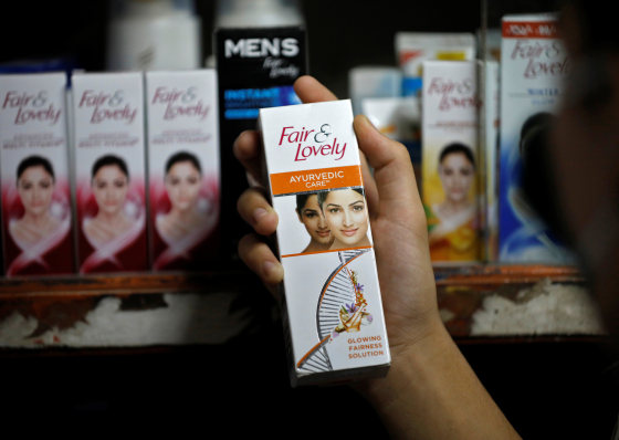 A customer picks up a \"Fair and Lovely\" skin lightening product in a shop in Ahmedabad, India, on June 25, 2020.