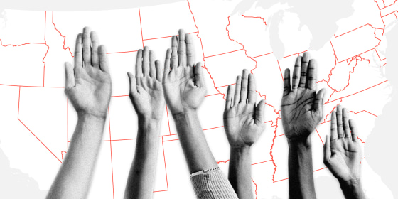 Image: A group of raised hands in front of a United States map.
