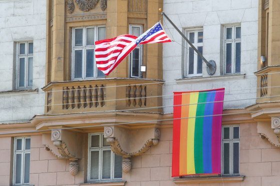 Image: The U.S. national flag and an LGBT pride flag hoisted on the front facade of the U.S. Embassy in Moscow.