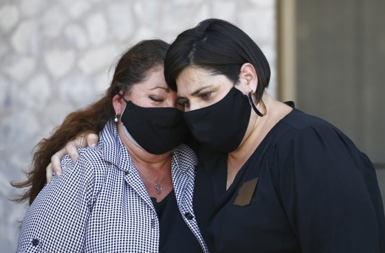 Denice Garcia, left, mother of James Garcia, who was shot last week by Phoenix police, is comforted by state Rep. Raquel Teran, D-Phoenix, during a news conference demanding the release of police body cam footage on July 8, 2020, in Phoenix, in the police shooting death of 28-year-old Garcia.