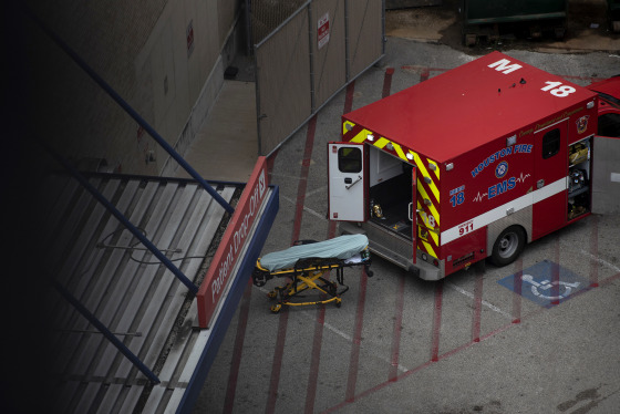 Image: An ambulance sits outside of the emergency room at Houston Methodist Hospital in the Texas Medical Center on July 6, 2020.