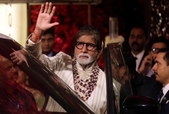 Image: Bollywood actor Amitabh Bachchan waving to fans in Mumbai, India