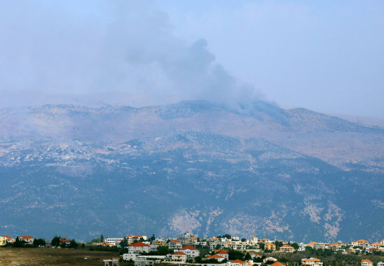 Image: Smoke rises from the disputed Shebaa Farms area as seen from Marjayoun village