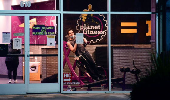 People work out at a Planet Fitness gym in Alhambra, Calif., on June 24, 2020.