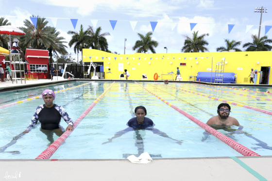 Ghenete Wright Muir, Masai Muir and Niki Lopez back in the pool at Joseph C. Carter Park for the swim-in protest.