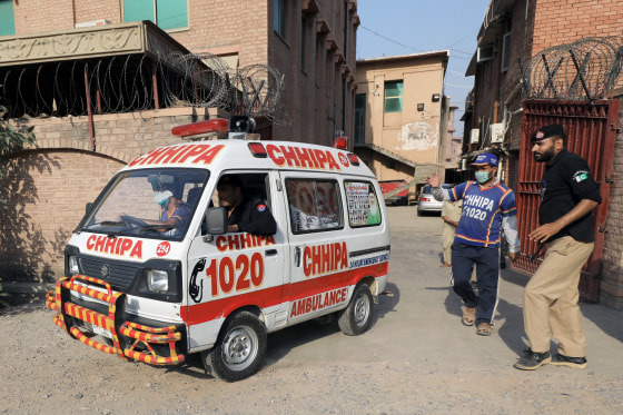 Image: An ambulance moves out of the Khyber Medical College (KMC) morgue, in Peshawar