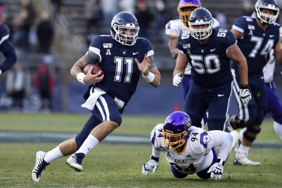 Connecticut quarterback Jack Zergiotis (11) gains yardage during the second half of an NCAA college football game against East Carolina Saturday in East Hartford, Conn., Nov. 23, 2019.