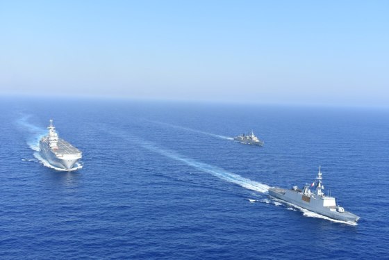 Image: Greek and French vessels sail in formation during a joint military exercise in Mediterranean sea