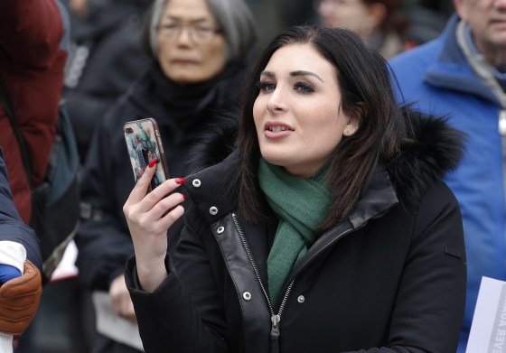 Image: Political activist Laura Loomer stands across from the Women's March 2019 in New York City.