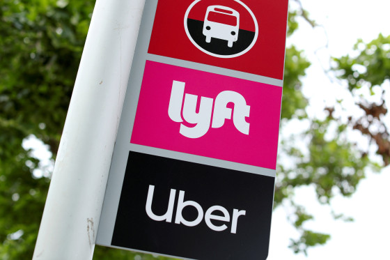 Image: A sign marks a rendezvous location for Lyft and Uber users at San Diego State University in San Diego
