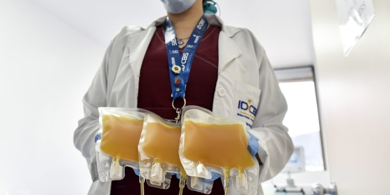 A nurse holds convalescent plasma donated by a man who recovered from COVID-19 in Bogotá, Colombia, on Aug. 14.