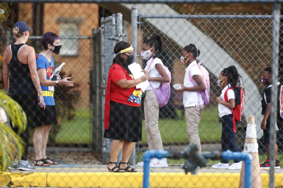 Image: Students return to school at Seminole Heights Elementary School in Tampa, Fla.