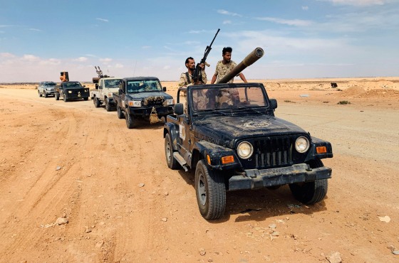 Image: Troops loyal to Libya's internationally recognized government patrol the area in Zamzam, near Abu Qareen