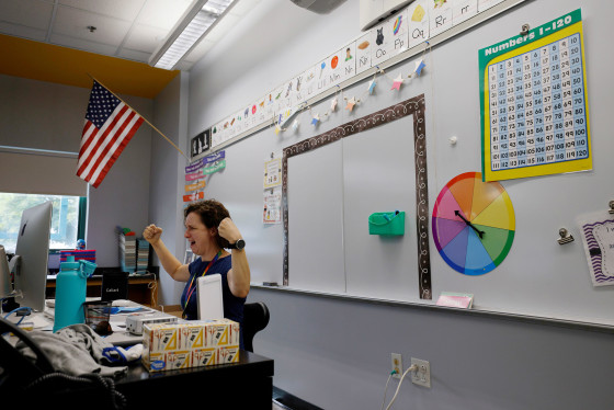 Image: Teacher Jessica Crane greets her first grade students virtually from her classroom at the Kelly Elementary School on the first day of the new school year in a city hard hit by the coronavirus disease (COVID-19) outbreak, in Chelsea, Massachusetts