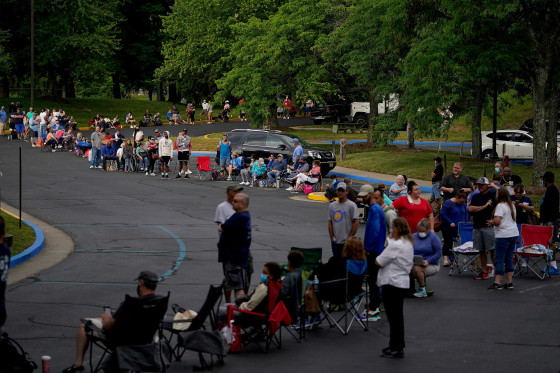 Image: People line up outside Kentucky Career Center prior to its opening to find assistance with their unemployment claims in Frankfort, KY.