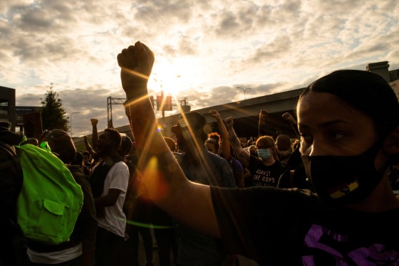 Image: People react after a decision in the criminal case against police officers involved in the death of Breonna Taylor, in Louisville