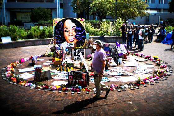Image: People react after a decision in the criminal case against police officers involved in the death of Breonna Taylor, in Louisville
