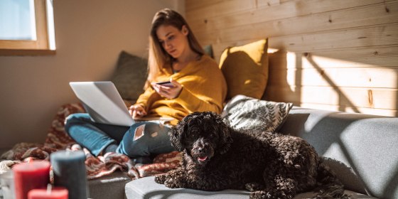 Relaxed Woman Purchasing Online from Living Room
