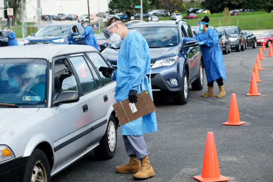 Image: FILE PHOTO: People line up to get COVID-19 tests in Milwaukee