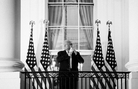 Image: President Donald Trump removes his mask after returning to the White House after receiving treatment for Covid-19 at Walter Reed Medical Center on Oct. 5, 2020.