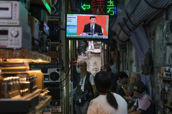 Image: A news report on Chinese President Xi Jinping's speech in the city of Shenzhen is shown on a television screen in Hong Kong, China
