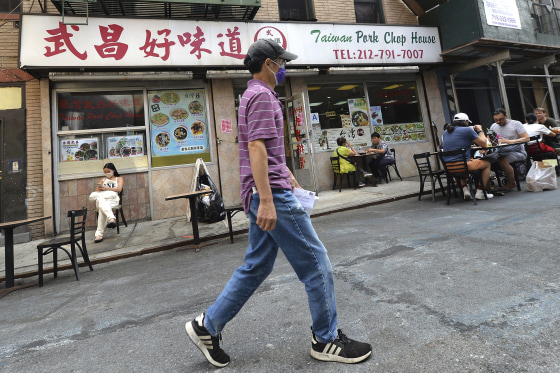 Patrons eat at outdoor tables in Manhattan's Chinatown on Aug. 11.