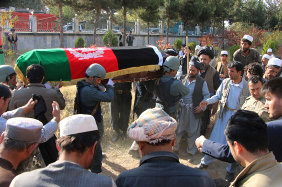 Image: People attend the funeral ceremony of senior police officer Raz Mohammad Dorandish in Taluqan, capital of Takhar province, Afghanistan