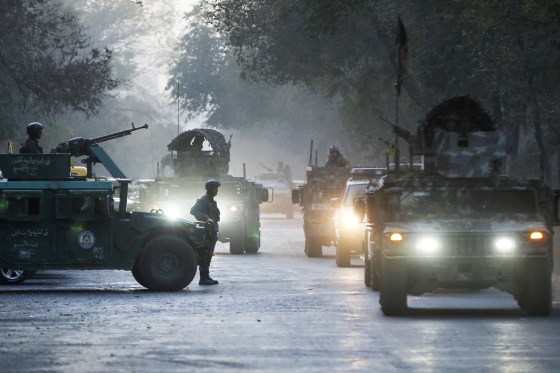 Image: Afghan security forces leave the site of an incident after an attack at the university of Kabul