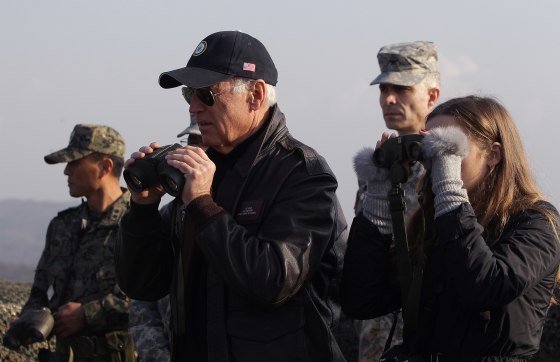 Image: Vice President Joe Biden and his granddaughter Finnegan Biden look through binoculars toward North Korea during a visit to observation post Ouellette at the Demilitarized Zone