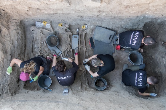 Members of the Association for the Recovery of Historical Memory exhume remains from a site in Segovia, Spain.