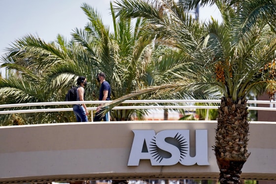 People use a footbridge over University Avenue on the campus of Arizona State University on Sept. 1, 2020, in Tempe.