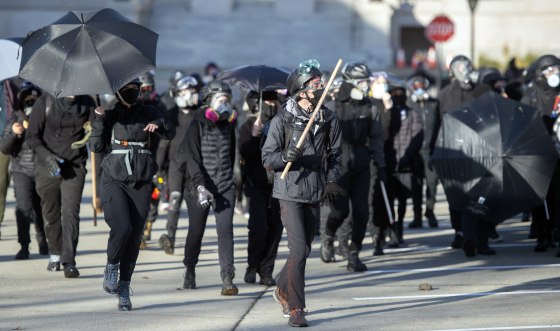 Image: A group of protesters march through the Washington Capitol Campus and downtown Olympia, Wash.
