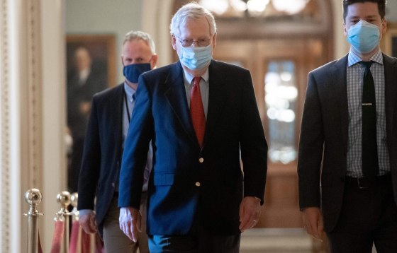 Image: Senate Majority Leader Mitch McConnell walks to his office from the Senate Floor at the U.S. Capitol,