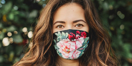 Woman wearing mask from Johnny Was Five-Piece Silk Charmeuse Face Mask Set