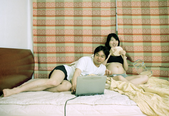 Image: A pregnant woman and her husband