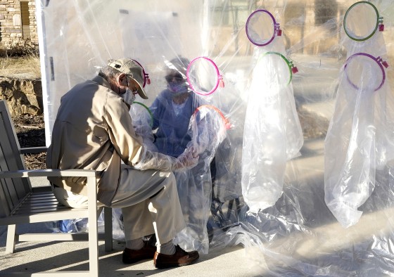 Image: Nursing Home In Longmont, Colorado Setups Up Hug Tent For Families To Embrace Loved Ones