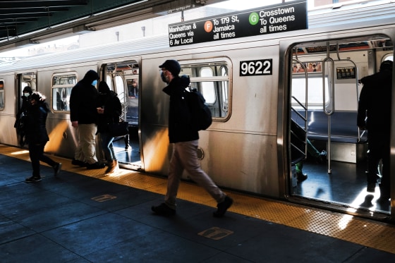 People walk off of a subway train at a Brooklyn station on Nov. 18, 2020 in New York City.