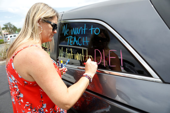 Florida teachers hold a protest in front of the Pasco County School district office