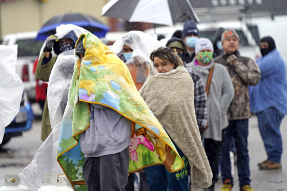 Image: People wait in line to fill propane tanks Wednesday, Feb. 17, 2021, in Houston.