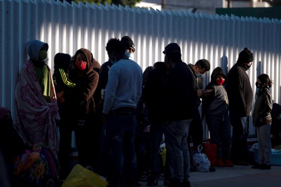 Image: Asylum seekers wait outside El Chaparral crossing port as they try to cross to the United States in Tijuana, Baja California state, Mexico on Feb. 19, 2021.