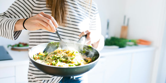 Woman cooking with her non stick pan